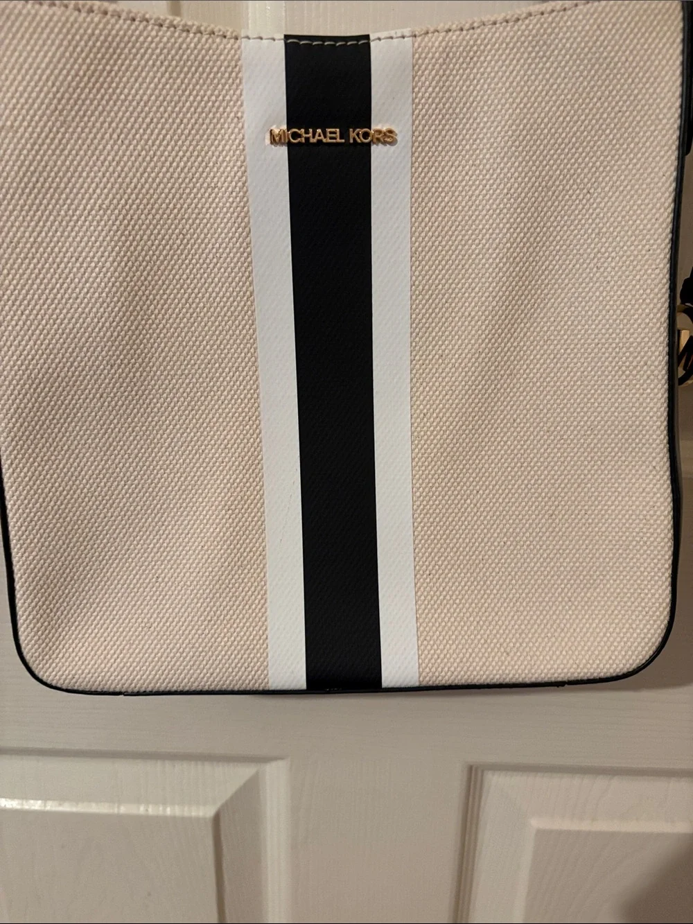 Mk  Beige Tote with Black and White Center Stripe. new w/o tags. Stiff until use